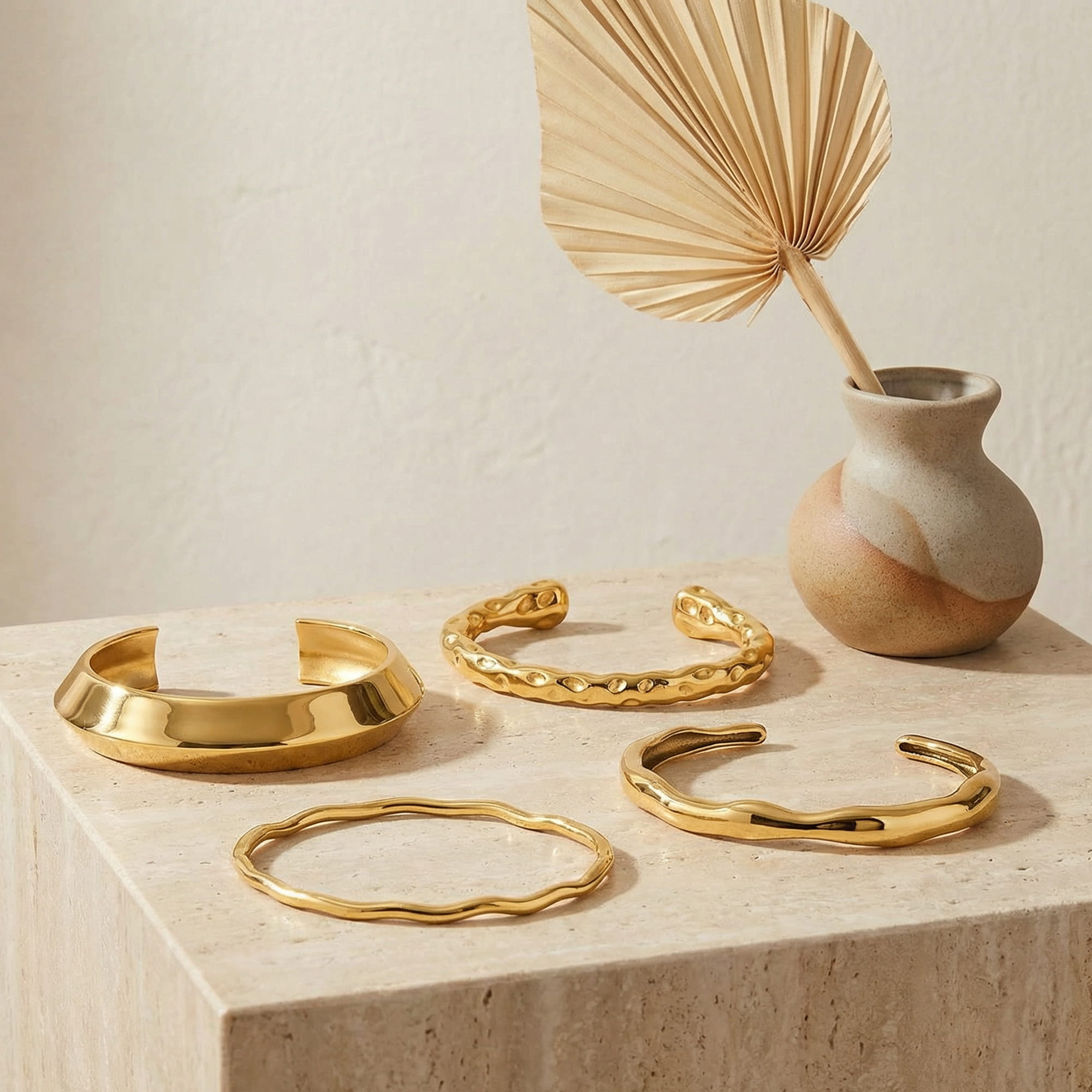 Handcrafted necklace and earrings laid on neutral linen with soft natural light and visible fine details