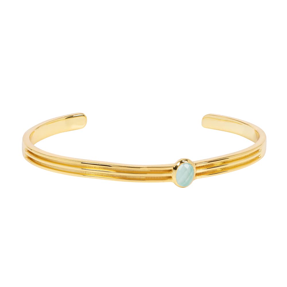 Designed with comfort, luxury and everyday wear in mind, the Athena Gold Cuff With Green Chalcedony is a sleek and lustrous bangle featuring a stunning hand cut green gemstone. The perfect base layer for your wrist stack.