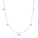 The Eva Aquamarine Reversible Necklace with gold discs features delicate vintage gemstones as well as reycled 18k gold. Reversite it for a more embossed texture or wear it smooth with your other sustainable necklaces.