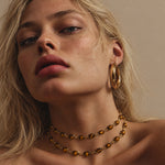 Vintage tiger’s eye gemstones bring rich golden-brown tones to the Luna necklace, complemented by the warmth of an 18k gold vermeil chain.
