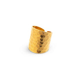 A striking ring, with a embossed texture that flatters and flows around the finger, the Nudo Gold Hammered Ring is size adjustable and handmade with sustainable 18k gold vermeil.