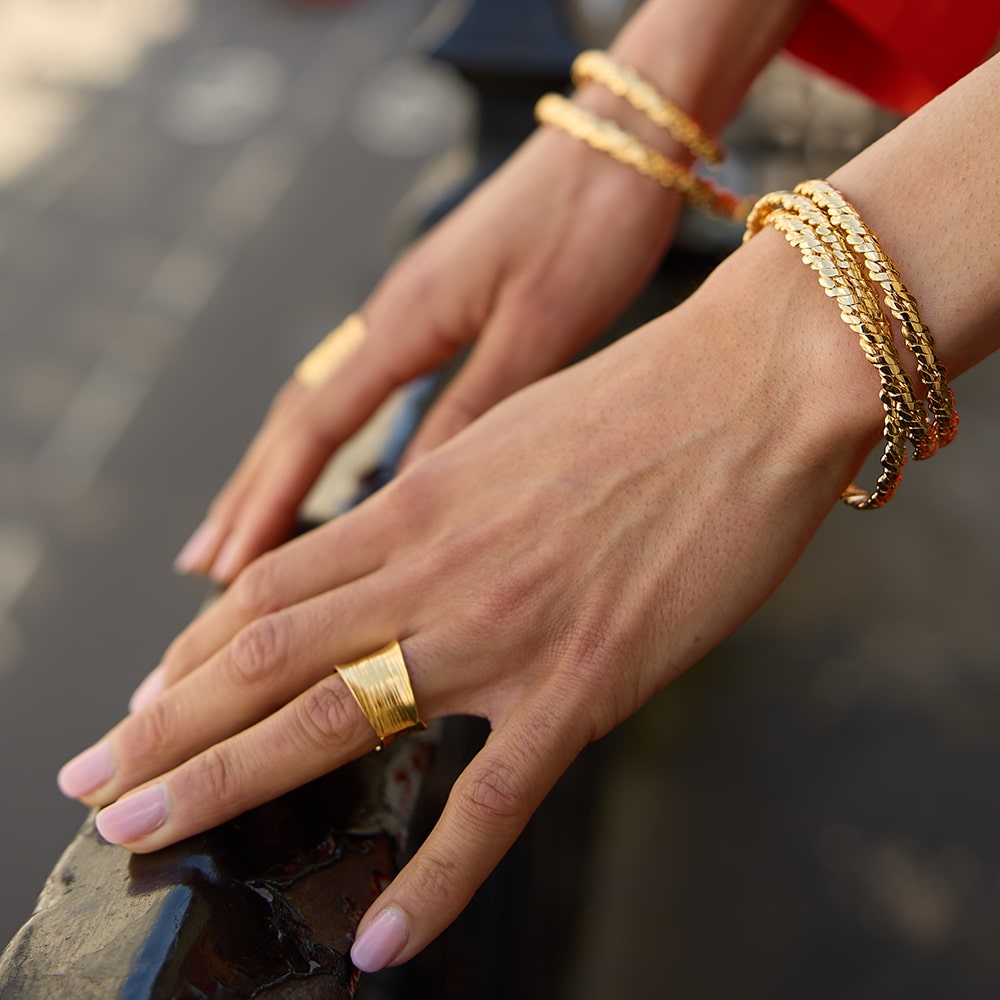 The Otto Twiste Gold Bangle  can simply be worn with a white t-shirt or used to bring a little bit of glam to an evening dress. Delicately handmade to fit any wrist size, the Otto bangles are the perfect finishing touch whether you’re stacking them together or wearing one that holds a special meaning.
