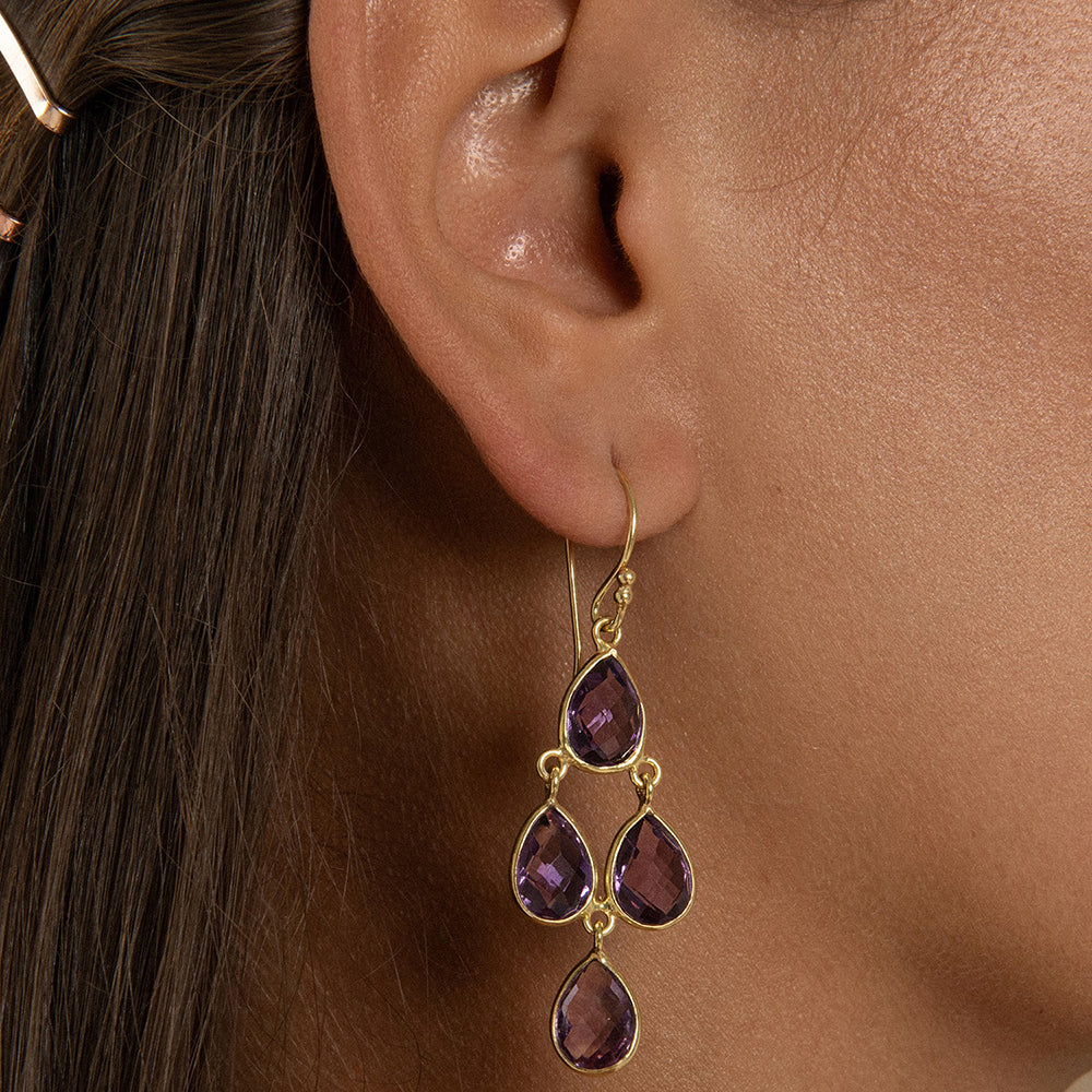 The Sophia Amethyst Chandelier Earrings feature four pear shaped multifaceted&nbsp; vintage gemstones.&nbsp;Simple, elegant but standout these sustainable earrings are a must-have.