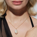 The Venus gold chain necklace showcases a large vintage Keshi pearl with tiny gold chips called barnacles. This elegant sustainable necklace features&nbsp; a unique shaped pearl, so no two are the same.&nbsp;