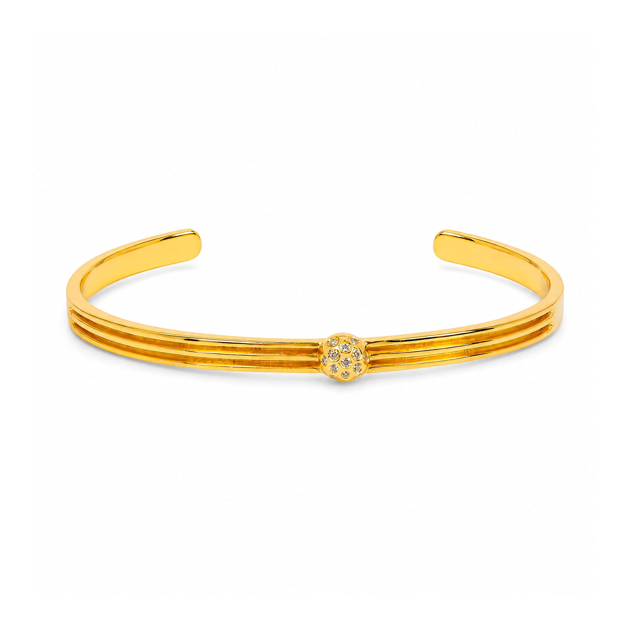 A polished gold-tone cuff bracelet with three parallel bands and a small round floral cluster detail at the center, shown on a clean white background.