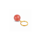 A faceted peach-pink stone keychain with a gold metal ring, shown on a plain white background.