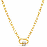 A gold paperclip chain necklace with a padlock pendant encrusted with small clear gemstones, shown on a plain white background.