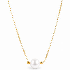 A delicate gold chain necklace featuring a single white pearl pendant flanked by two small gold beads, shown against a plain white background.
