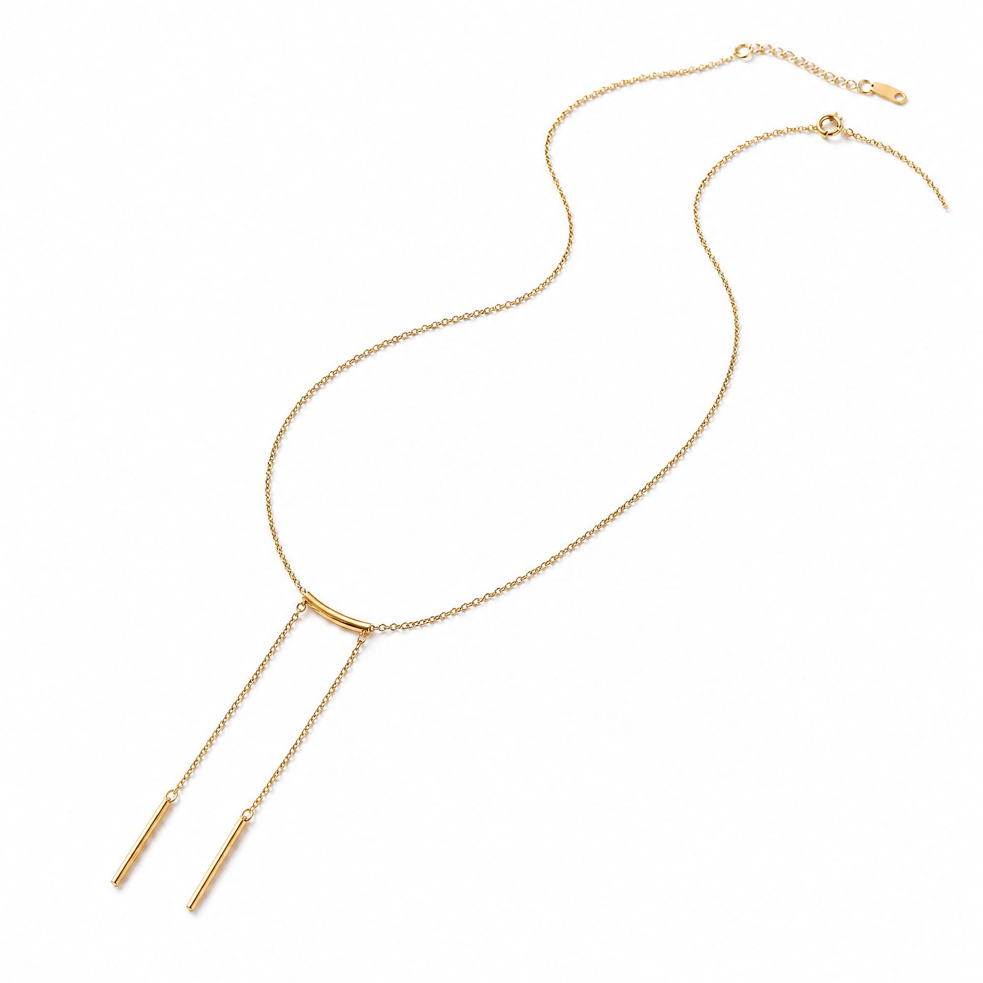A gold Y-shaped necklace with a delicate chain, a small curved bar at the center, and two thin drop chains ending in cylindrical pendants, shown on a plain white background.