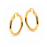 A pair of polished yellow gold hoop earrings on a clean white background.