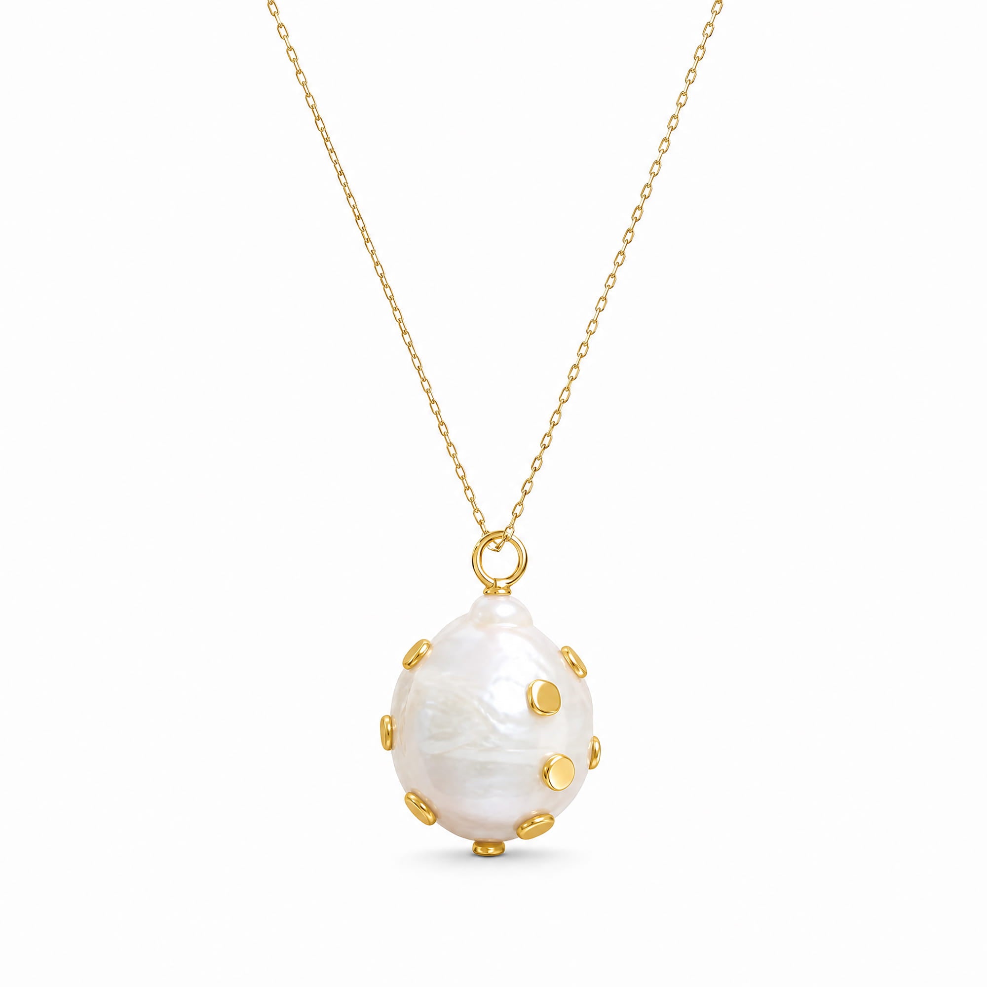 A gold chain necklace featuring a large, teardrop-shaped white mother-of-pearl pendant adorned with small gold studs, shown against a plain white background.