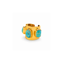 A wide gold cuff ring featuring three large, bezel-set oval turquoise stones, shown on a clean white background.