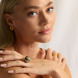 The Bubble Pyrite Gold Ring adds a luxe touch to any finger. With a size adjustable design and a shiny sustainable gemstone, this unique ring is a total head-turner.&nbsp;
