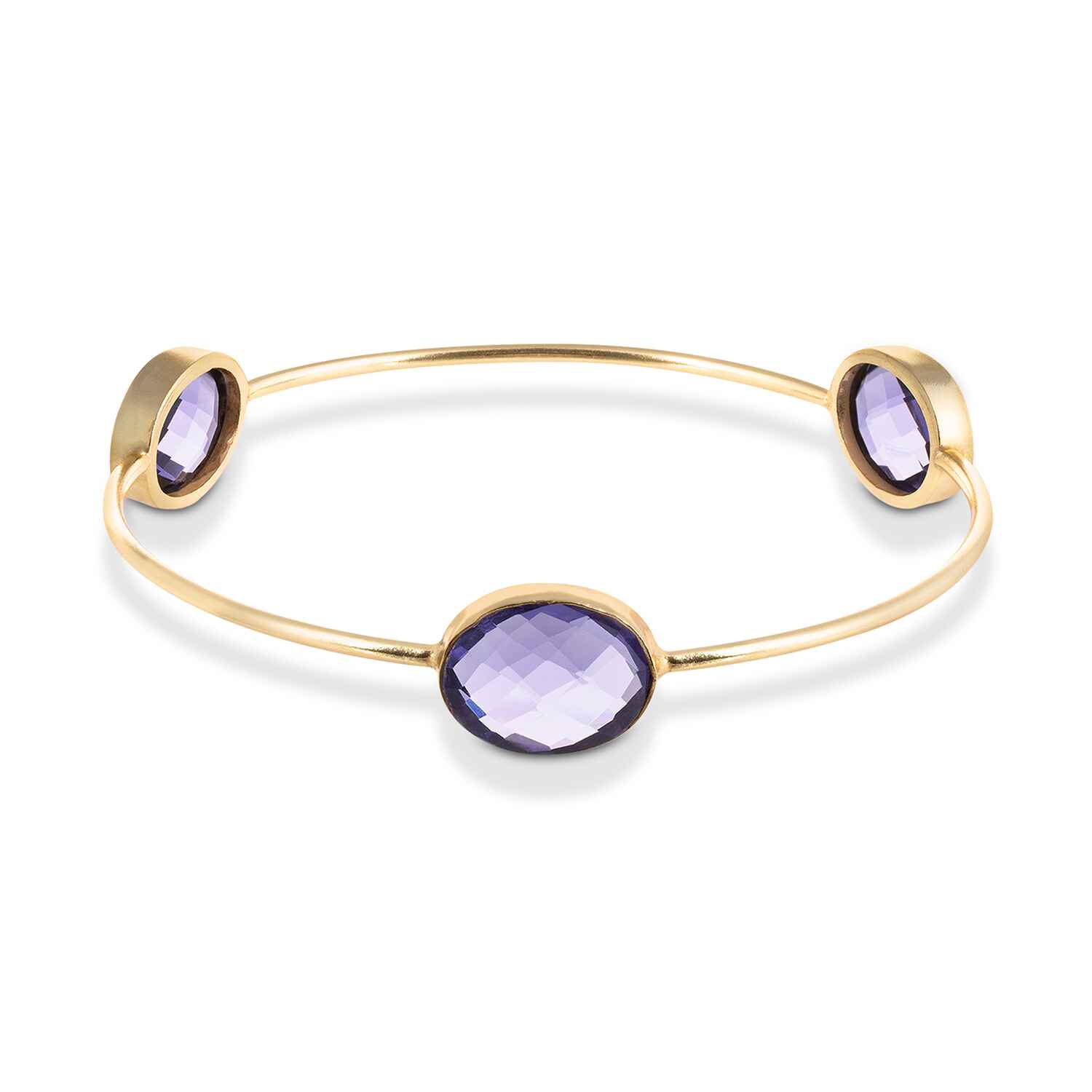 Our Sasha Gold Bangle With Lolite Gemstones is handmade with recycled materials for minimal environmental impact. Adorned with three stunning vintage lolite gemstones, this bangle catches the light with your every move.