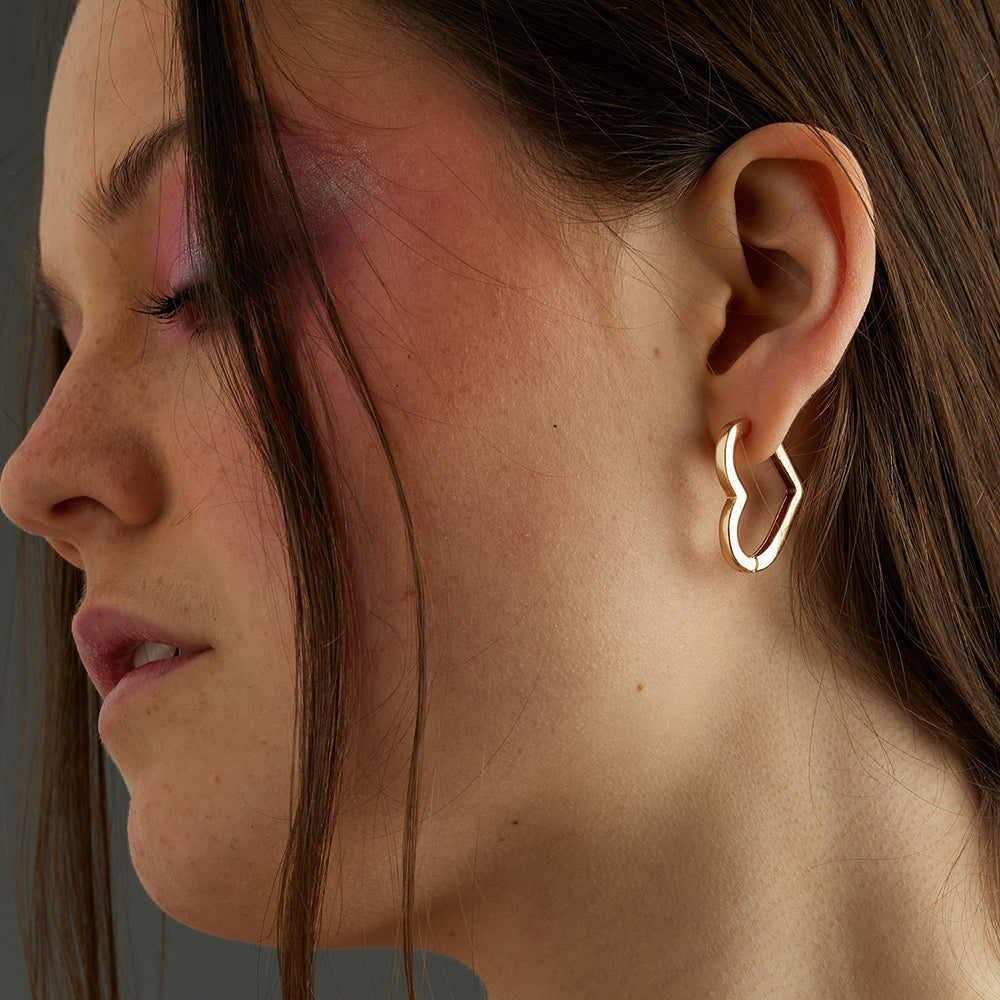 Fall in love with our Bella heart Shaped Hoops. Handmade into a cute heart shape with a smooth finish, these sustainable gold hoop earrings will be your forever go-to's.