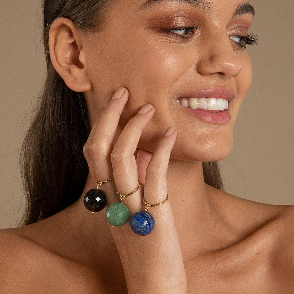 The Bubble Lapis Lazuli Ring features a deep celestial blue gemstone with gold chips, attached to a size adjustable 14 Carat gold vermeil ring. This allows the gemstone to move freely around your finger making this a unique ring. 