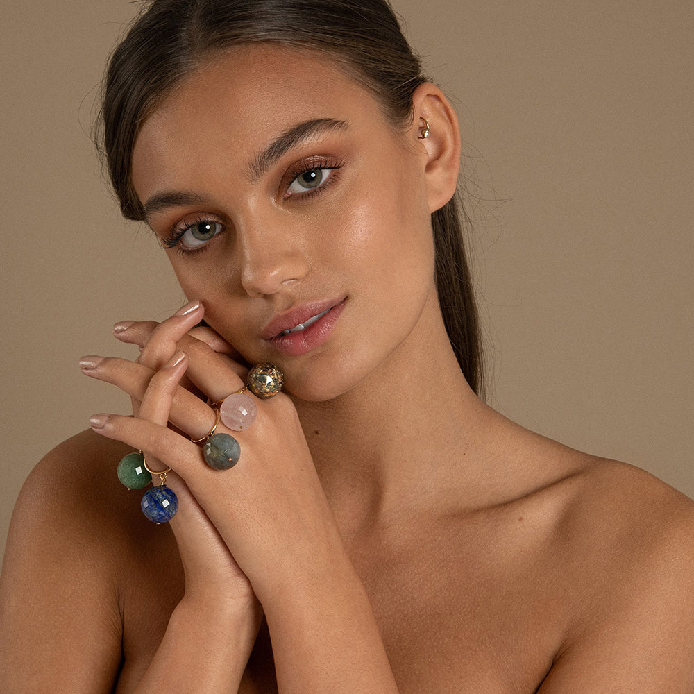 The Bubble Lapis Lazuli Ring features a deep celestial blue gemstone with gold chips, attached to a size adjustable 14 Carat gold vermeil ring. This allows the gemstone to move freely around your finger making this a unique ring. 