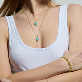 Put a gem in your life with the Eden Gold Chain Necklace with Amazonite Pendant. Handmade with sustainable materials, this necklace is simple and chic for every day wear.