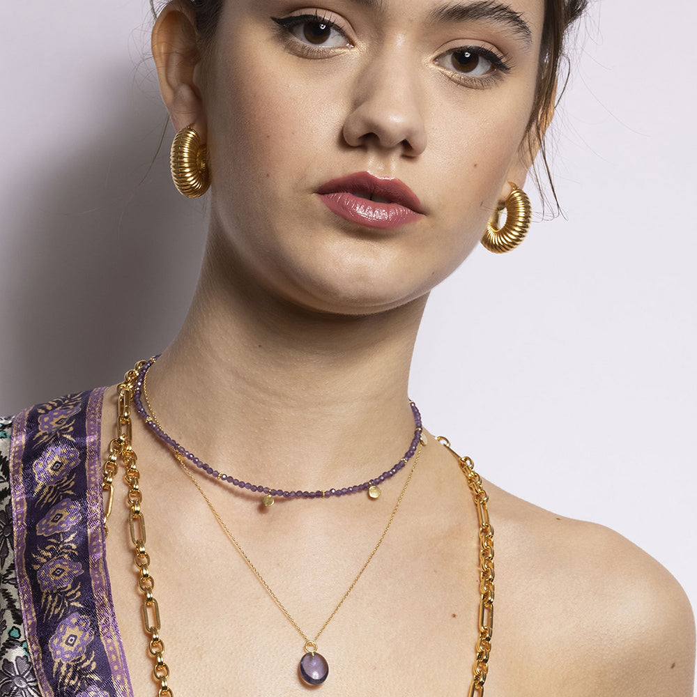 Add a pop of colour to any outfit with our Eden Gold Chain Necklace And Amethyst Pendant. Handmade in recycled 18k gold and a stunning vintage amethyst gemstone, this piece will be your new go to sustainable necklace.