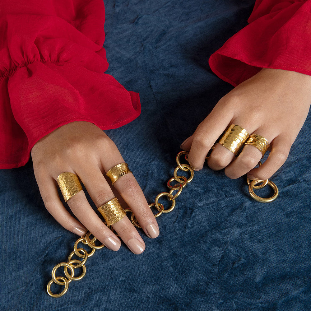 Our Nudo collection is an emblem of the modern jewellery that is a second skin to every woman. This fully size adjustable sustainable ring is hand-sculpted to define your daily look with an organic embossed surface with tiny gold dots. The ring can be worn on any part of the finger. 