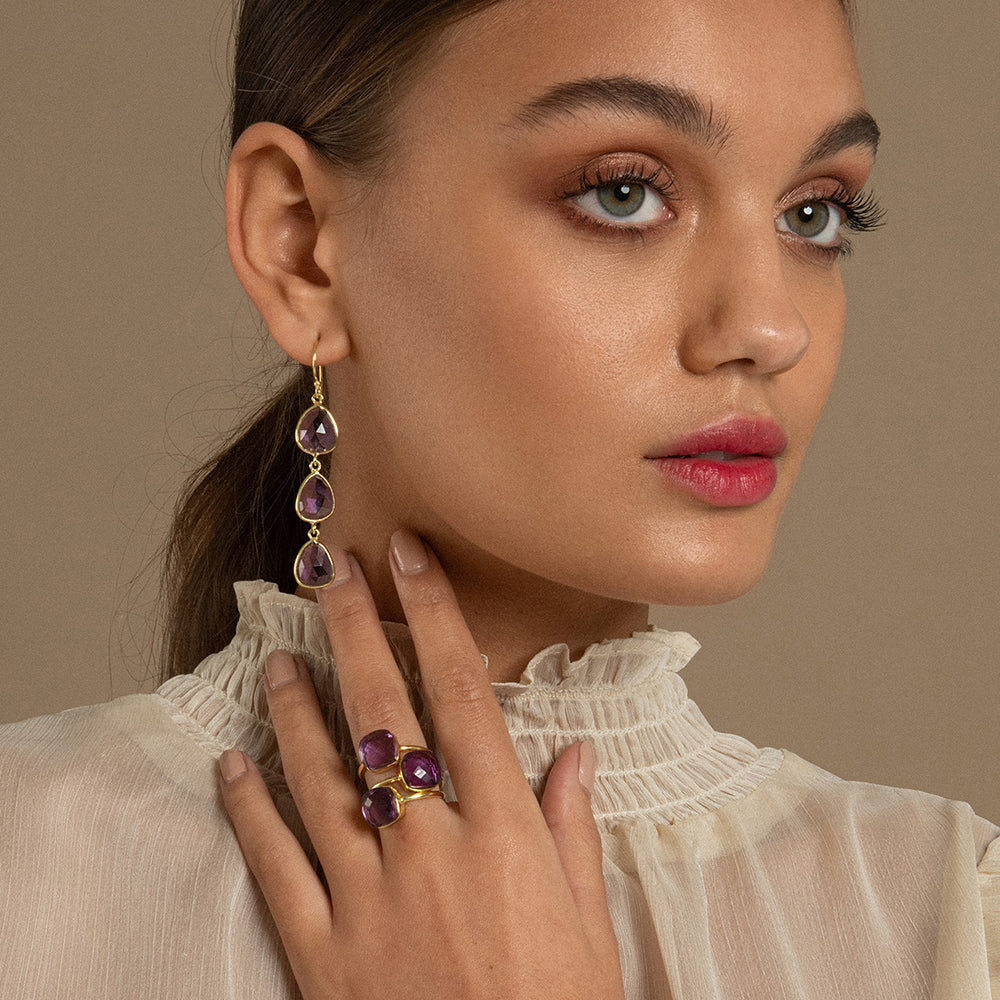 Light bounces through the facets and natural inner texture of this taper shaped and ethical amethyst gemstone. The Sophia Amethyst ring can be worn on its own or stacked with similar rings.