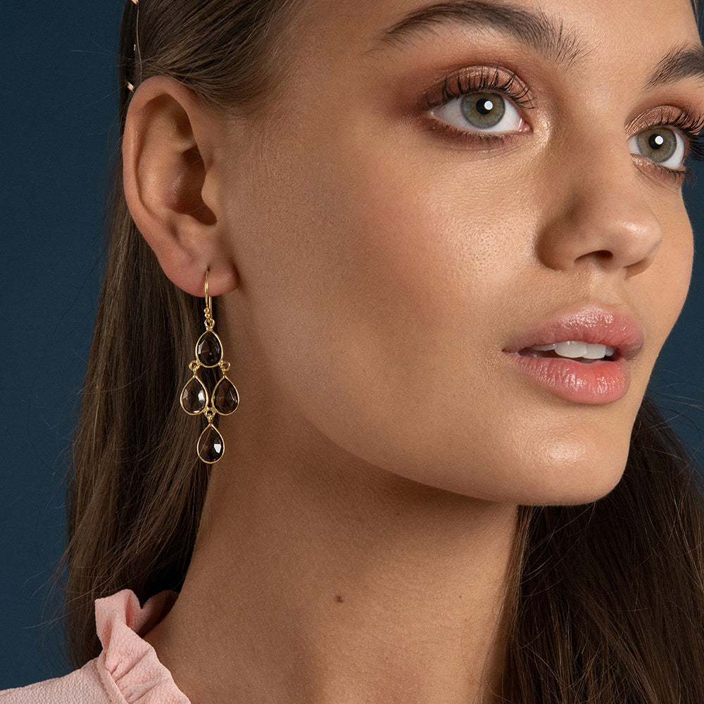 The Sophia Smokey Quartz Chandelier Earrings feature four pear shaped multifaceted vintage gemstones. Simple, elegant but standout these sustainable earrings are a must-have.