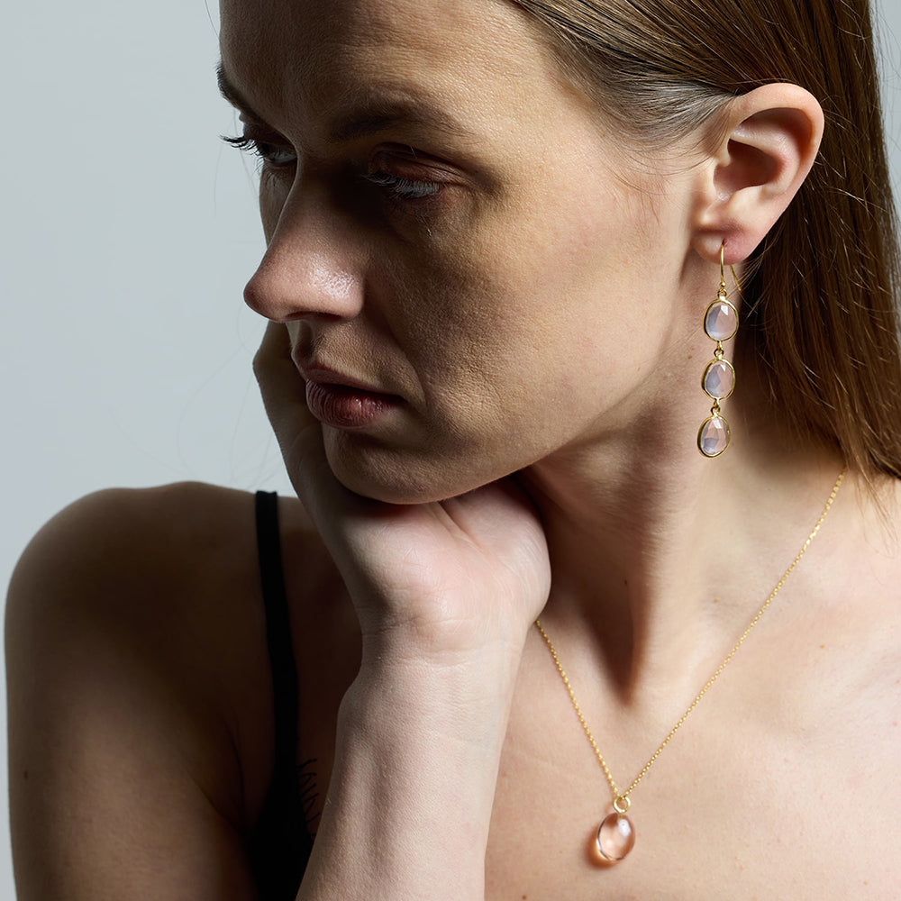 The Sophia Pink Quartz Dangle Earrings feature three, hand cut, vintage pink quartz gemstones, hand set in sustainable gold.
